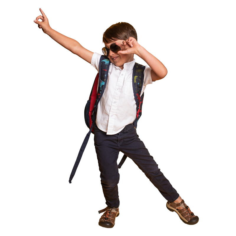 Dancing schoolboy wearing sunglasses and rucksack